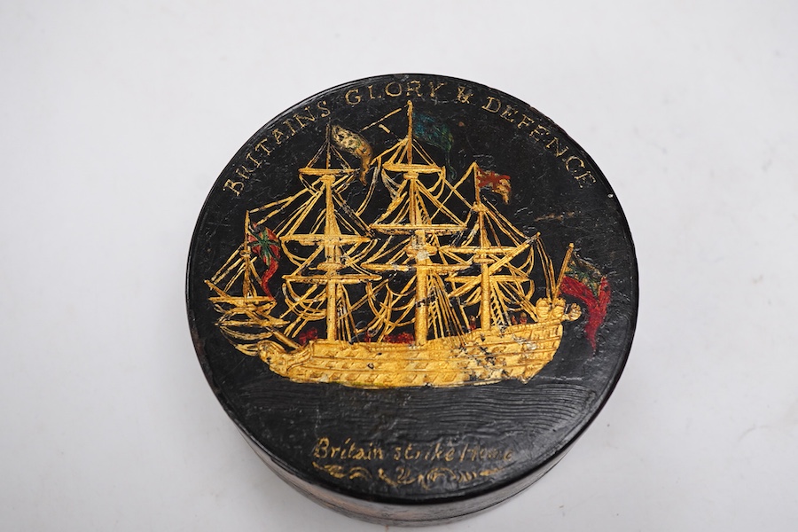 A 19th century 'Britains Glory & Defence' gilt decorated black lacquer circular box, 8.5cm diameter
